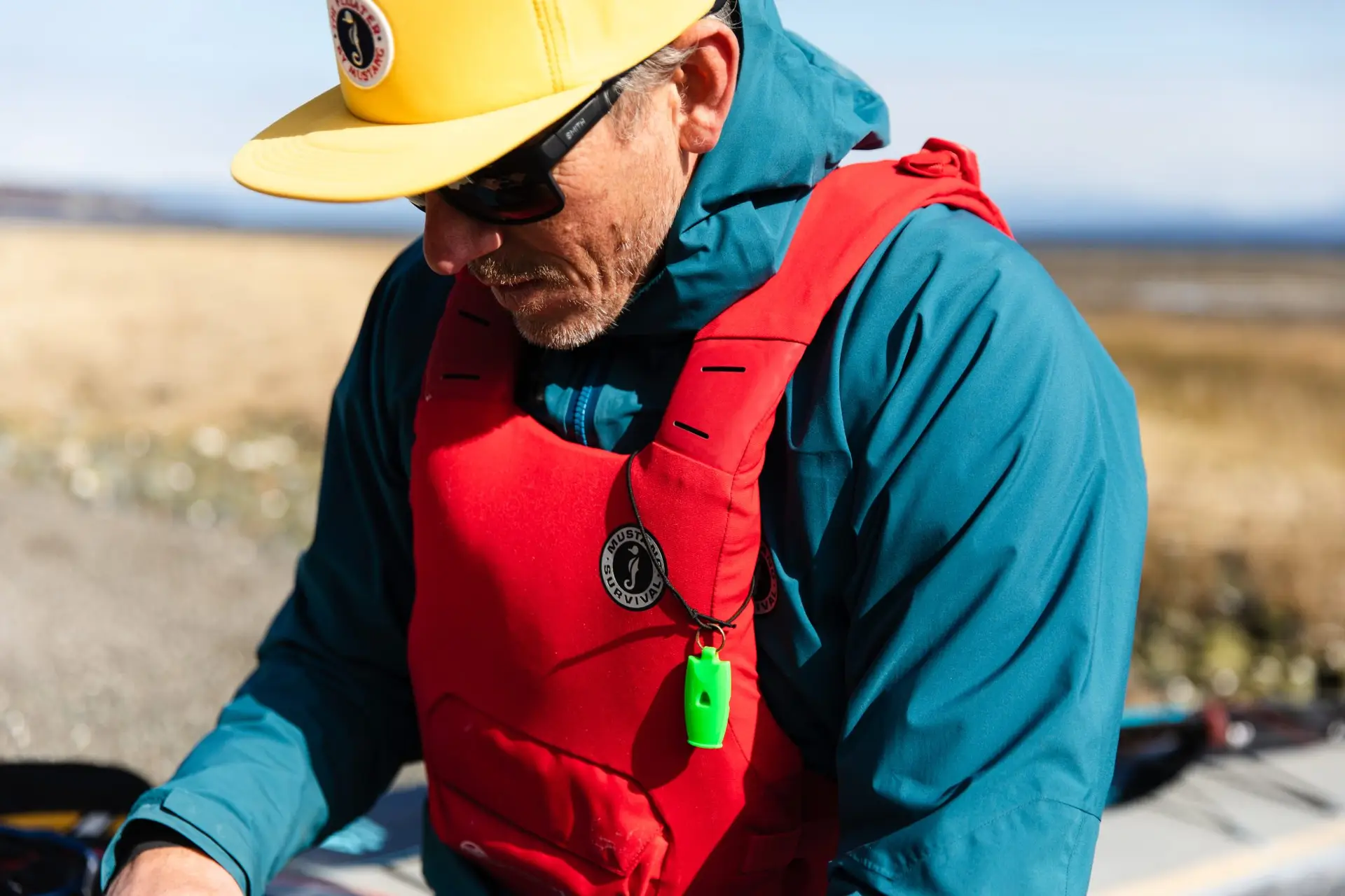 Closeup of Norm Hann wearing a Mustang PFD