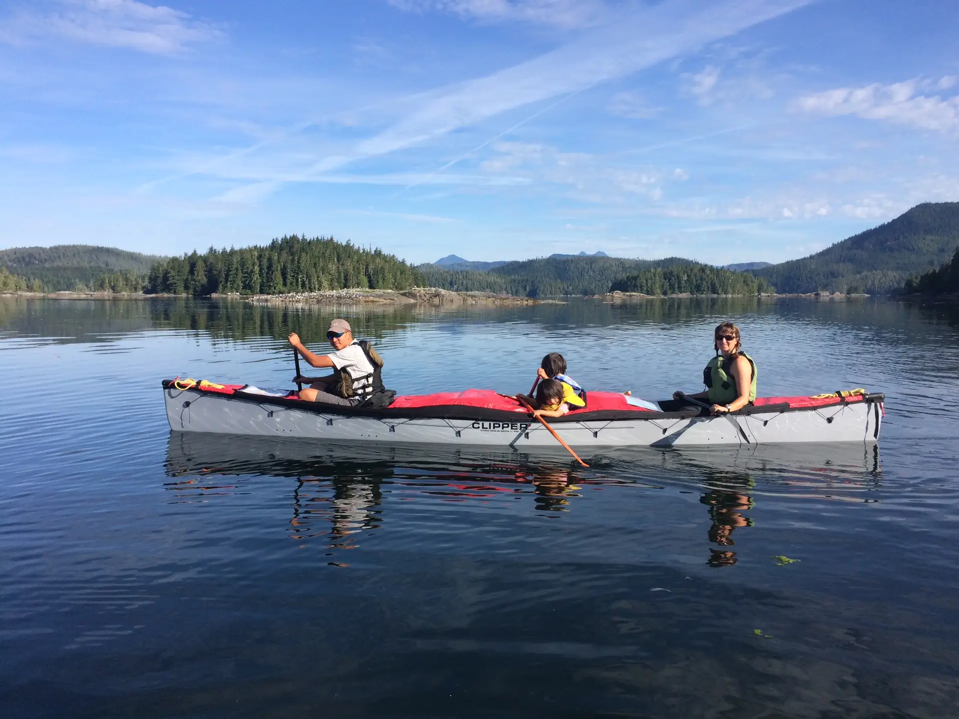 Family paddling a canoe