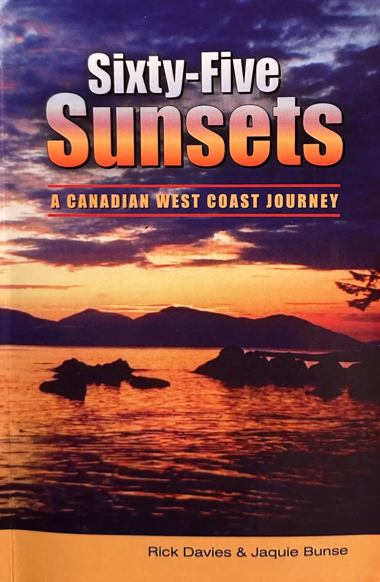 Book cover: 'Sixty-Five Sunsets' with a sunset over water and rocks; subtitle 'A Canadian West Coast Journey'; authors Rick Davies & Jaquie Bunse (sic).